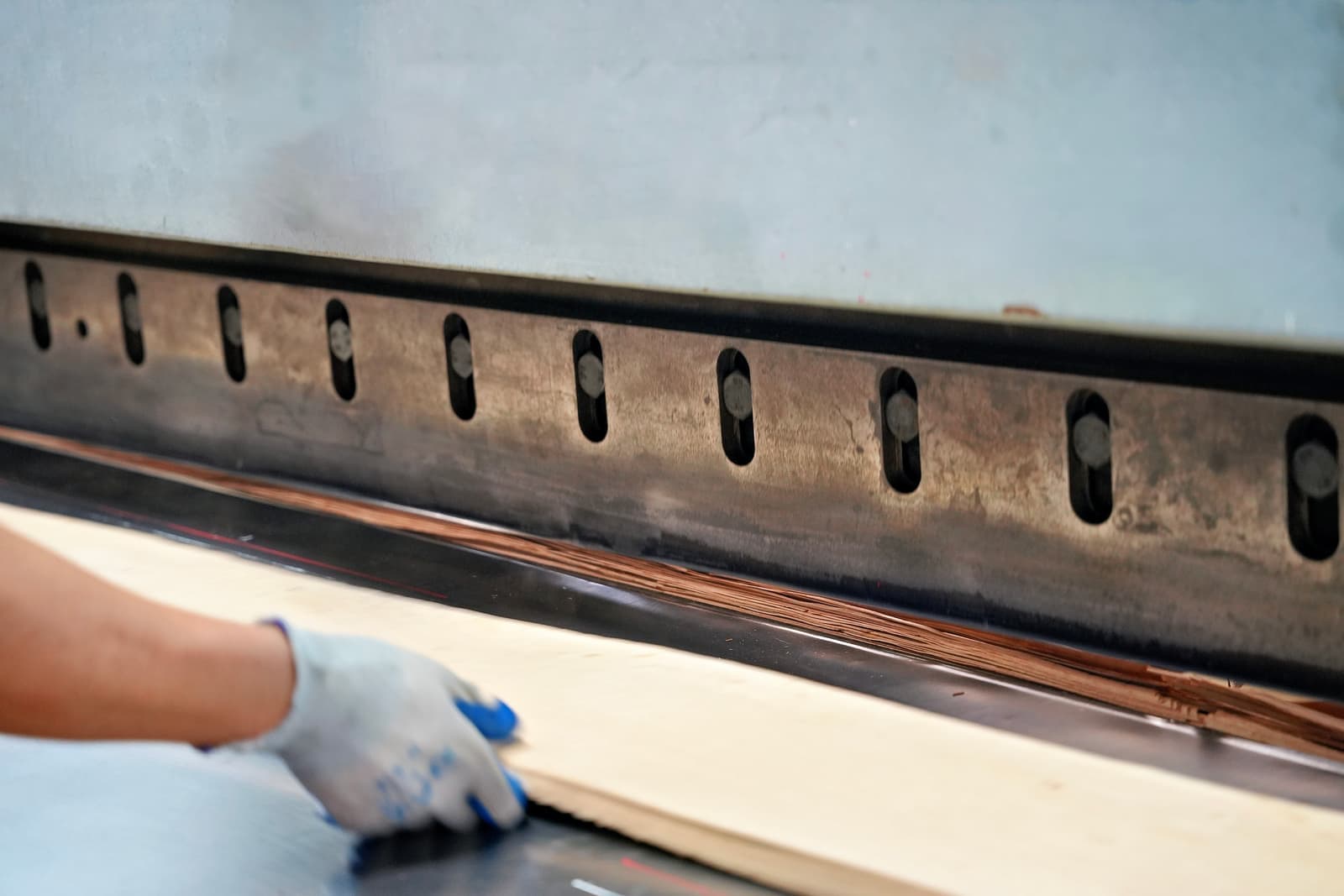 Veneer sheet being squared before bundling