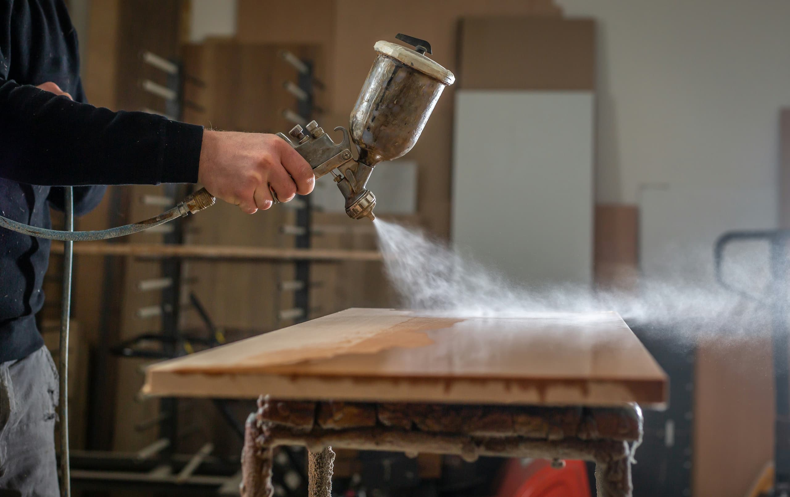 Operator guiding a log through the bandsaw